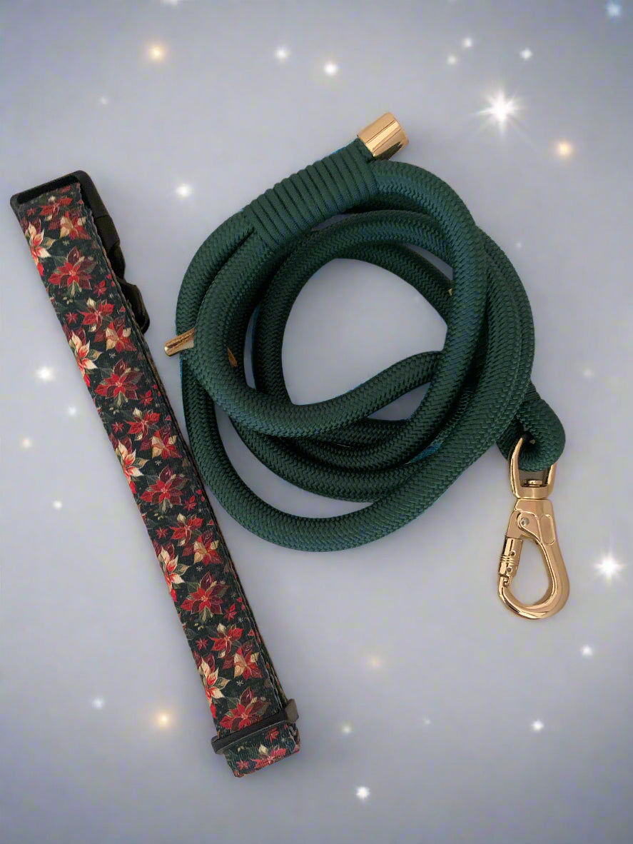 Green rope dog leash with brass clip and floral-patterned dog collar on a wooden surface